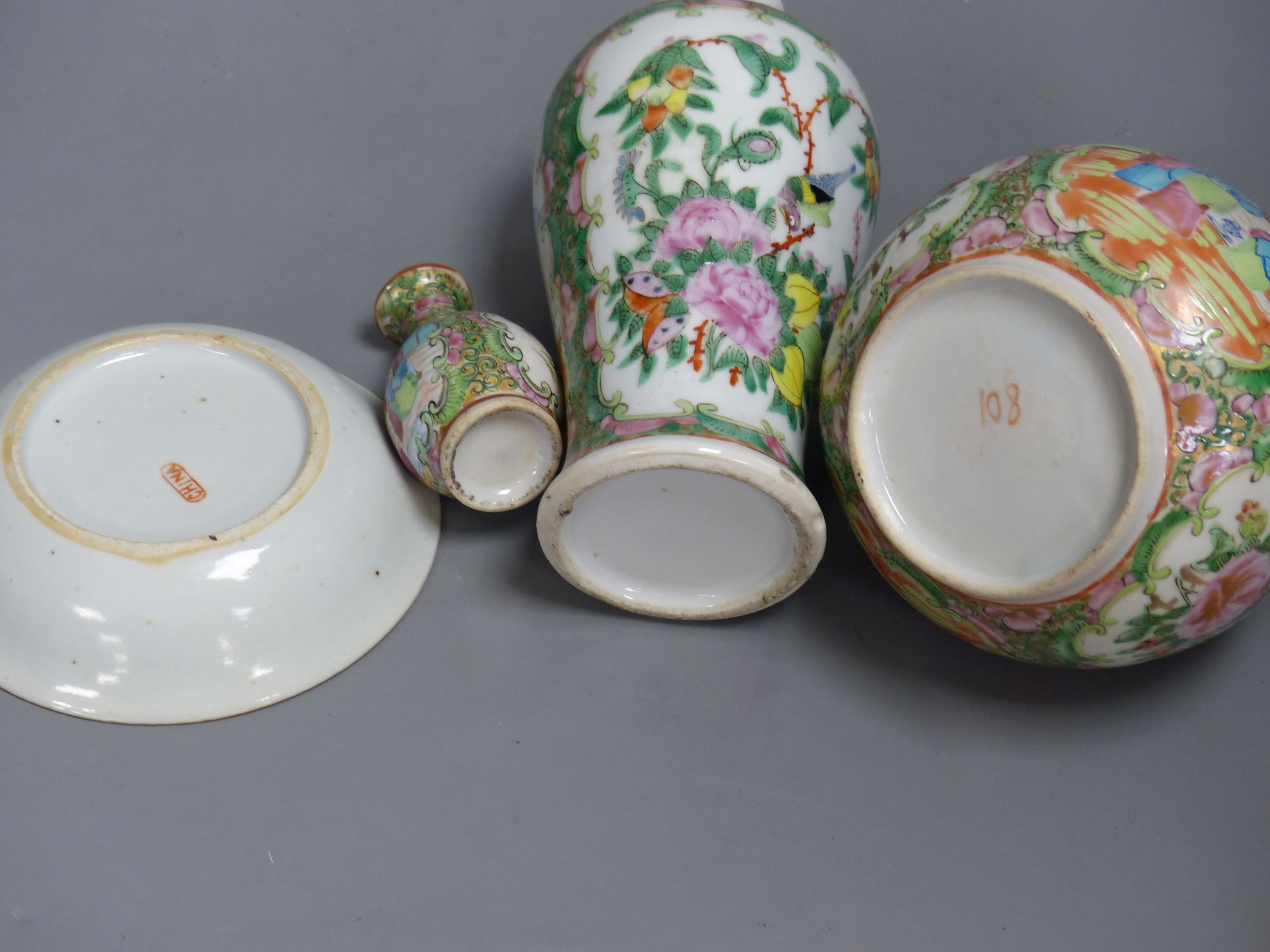 A Chinese famille rose box and cover, two vases, a sugar bowl and cover and a saucer, late 19th/early 20th century, tallest 19cm